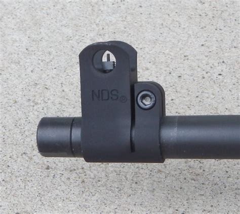 Has an enhanced trigger and a baseplate trigger retainer. . Nodak spud iron sights